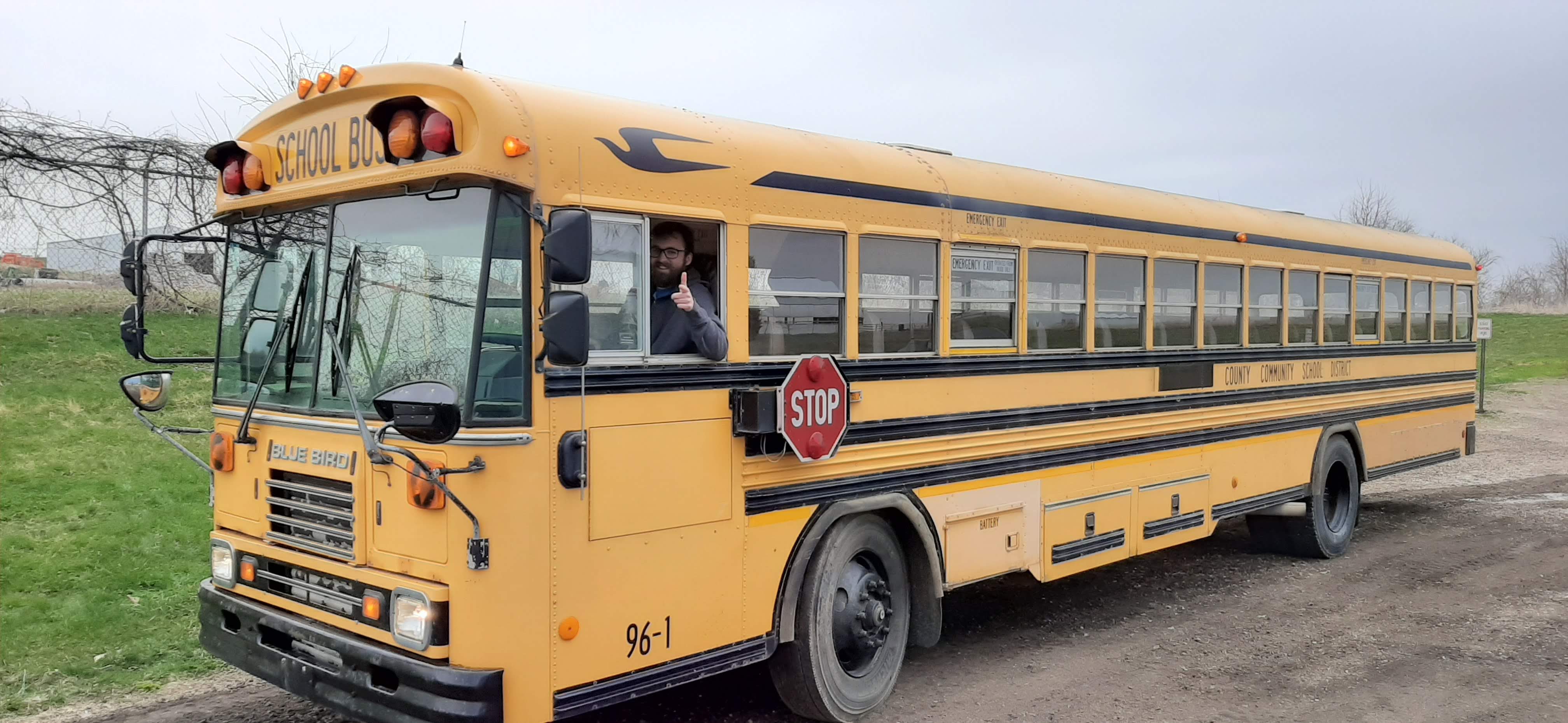 The Finished bus parked at a gas station